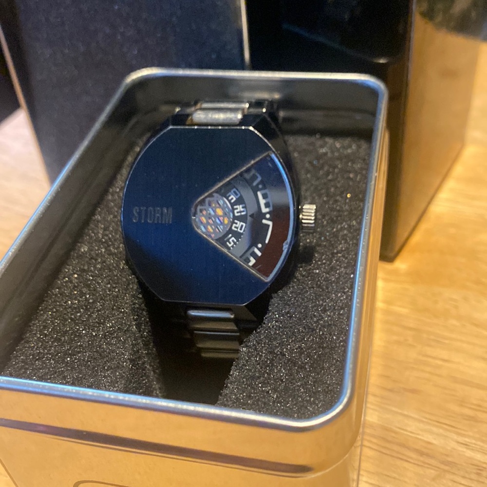 London storm brand jump hour watch. Black & silver.
